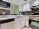 Modern kitchen featuring stainless steel appliances and updated backsplash at 2745 Enterprise E Rd # 24, Clearwater, FL 33759