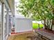 Private backyard with a wood fence and patio table at 2745 Enterprise E Rd # 24, Clearwater, FL 33759
