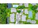 Aerial view of condo community, pool, tennis court, and lush landscaping at 2745 Enterprise E Rd # 24, Clearwater, FL 33759
