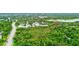 Aerial view of condo community and surrounding lush green landscape at 2745 Enterprise E Rd # 24, Clearwater, FL 33759