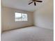 Spacious bedroom with ceiling fan and window at 2745 Enterprise E Rd # 24, Clearwater, FL 33759