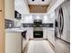 Updated kitchen with stainless steel appliances and mosaic backsplash at 2745 Enterprise E Rd # 24, Clearwater, FL 33759