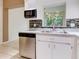 Bright kitchen features stainless steel appliances and tile backsplash at 2745 Enterprise E Rd # 24, Clearwater, FL 33759