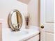Clean bathroom with a pedestal sink and an oval mirror at 2745 Enterprise E Rd # 24, Clearwater, FL 33759