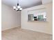 Bright dining room featuring a chandelier and kitchen view at 2745 Enterprise E Rd # 24, Clearwater, FL 33759