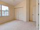 Bright bedroom with double-door closet and neutral decor at 2745 Enterprise E Rd # 24, Clearwater, FL 33759