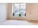 Bright living room with large window and neutral decor at 2745 Enterprise E Rd # 24, Clearwater, FL 33759