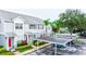 Townhouse exterior with covered parking and landscaping at 2745 Enterprise E Rd # 24, Clearwater, FL 33759