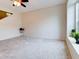 Living room with window, ceiling fan, and stairs at 2745 Enterprise E Rd # 24, Clearwater, FL 33759