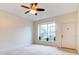 Spacious living room with window and ceiling fan at 2745 Enterprise E Rd # 24, Clearwater, FL 33759