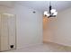 Dining room with chandelier and access to hallway at 2745 Enterprise E Rd # 24, Clearwater, FL 33759