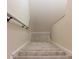 Carpeted staircase leading to upper levels at 2745 Enterprise E Rd # 24, Clearwater, FL 33759