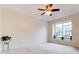 Living room with window, ceiling fan and plant at 2745 Enterprise E Rd # 24, Clearwater, FL 33759