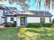 House exterior with green lawn and shrubs at 1211 N Mcmullen Booth Rd # 1211, Clearwater, FL 33759