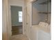 Convenient laundry area with washer, dryer, and shelving at 1211 N Mcmullen Booth Rd # 1211, Clearwater, FL 33759