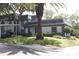 Condo building with palm tree and carport at 1211 N Mcmullen Booth Rd # 1211, Clearwater, FL 33759