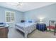 Bedroom with a full-size bed and window with shutters at 4115 34Th S Way # 195, St Petersburg, FL 33711