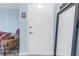 Entry showing door, flooring, mirror and adjacent living room seating at 4115 34Th S Way # 195, St Petersburg, FL 33711