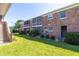 Brick building exterior with well-maintained landscaping at 4115 34Th S Way # 195, St Petersburg, FL 33711