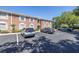 Brick condo building featuring assigned parking spaces and a well-maintained exterior at 4115 34Th S Way # 195, St Petersburg, FL 33711