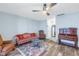 Comfortable living room featuring a ceiling fan, hardwood floors, and traditional decor at 4115 34Th S Way # 195, St Petersburg, FL 33711