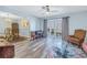 Living room featuring hardwood floors and access to a patio at 4115 34Th S Way # 195, St Petersburg, FL 33711