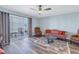 Cozy living room with a ceiling fan, glass doors, and comfortable furniture at 4115 34Th S Way # 195, St Petersburg, FL 33711