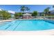 Community pool with a white fence and clear blue water perfect for relaxation at 4115 34Th S Way # 195, St Petersburg, FL 33711