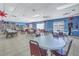 Community room with tables, chairs, and bookcases at 4115 34Th S Way # 195, St Petersburg, FL 33711