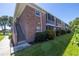 Brick building exterior with landscaping and stairs at 4115 34Th S Way # 195, St Petersburg, FL 33711