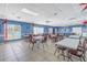Bright community room with tables and chairs at 4115 34Th S Way # 195, St Petersburg, FL 33711