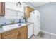 Kitchen features white appliances and a double sink at 4115 34Th S Way # 195, St Petersburg, FL 33711