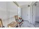 Relaxing screened-in patio with wooden chairs and plants at 4115 34Th S Way # 195, St Petersburg, FL 33711