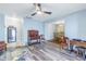 Bright living room with hardwood floors and view into dining area at 4115 34Th S Way # 195, St Petersburg, FL 33711