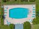 Community swimming pool with lounge chairs at 4115 34Th S Way # 195, St Petersburg, FL 33711