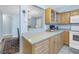 Kitchen boasts light wood cabinets and spacious countertops at 4115 34Th S Way # 195, St Petersburg, FL 33711