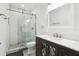 Modern bathroom features a glass-enclosed shower and vanity with stylish mirror accents at 2272 Chianti Pl # 4-0048, Palm Harbor, FL 34683