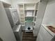 Stackable washer and dryer with ample shelving at 224 6Th N Ave # 12, St Petersburg, FL 33701