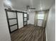 Spacious bedroom with wood-look floors and ceiling fan at 224 6Th N Ave # 12, St Petersburg, FL 33701