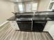 Sleek kitchen with black appliances and granite countertops at 224 6Th N Ave # 12, St Petersburg, FL 33701