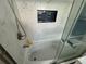Relaxing bathroom tub with marble tile surround and glass enclosure at 224 6Th N Ave # 12, St Petersburg, FL 33701