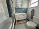 Updated bathroom with white vanity, marble floors, and a jetted tub at 224 6Th N Ave # 12, St Petersburg, FL 33701