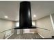 Modern black range hood with glass accents at 224 6Th N Ave # 12, St Petersburg, FL 33701