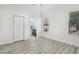 Bright bedroom with wood-look floors and an ensuite bathroom at 2272 Chianti Pl # 4-0048, Palm Harbor, FL 34683