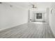 Open living area with hardwood floors and a large window at 2272 Chianti Pl # 4-0048, Palm Harbor, FL 34683