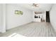 Bright and airy living room with light grey wood flooring and open floor plan at 2272 Chianti Pl # 4-0048, Palm Harbor, FL 34683