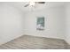Well-lit bedroom with hardwood floors and window blinds at 2272 Chianti Pl # 4-0048, Palm Harbor, FL 34683