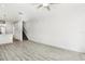 Bright living room with hardwood floors and a ceiling fan at 2272 Chianti Pl # 4-0048, Palm Harbor, FL 34683