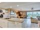 Open kitchen with island that overlooks the living room at 19610 Gulf Blvd # 308, Indian Shores, FL 33785