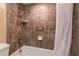 Shower and bathtub with tiled walls at 19610 Gulf Blvd # 308, Indian Shores, FL 33785